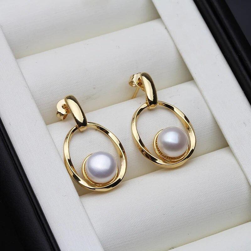 Elegant Earrings Made of Gold and Pearls